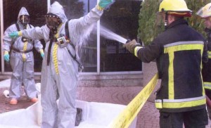 Marcus spill responder being decontaminated by Chatham Fire Department personnel. 