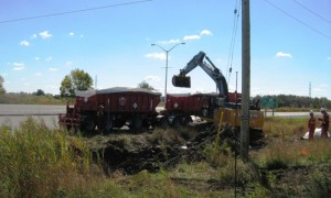 Btrains being loaded with fuel contaminated soil along 401 Highway.