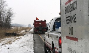 Marcus spill responders performing lane closures on Highway 401 for soil removal.