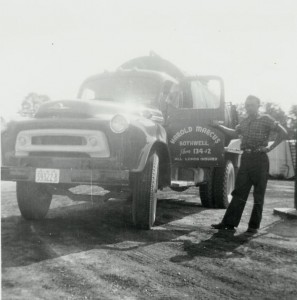 Employee, James Coleman, standing with 1959 I.H.C. truck. (1959)