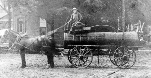 Harold's father, Andy, hauling oil by horse and wagon into Bothwell.