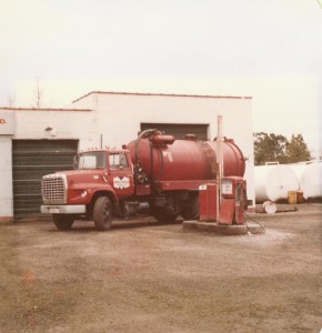 Small vacuum truck in front of Harold Marcus Limited. (Est. 1980's)